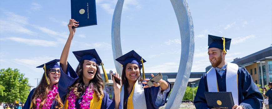 UC Merced graduates celebrating commencement.