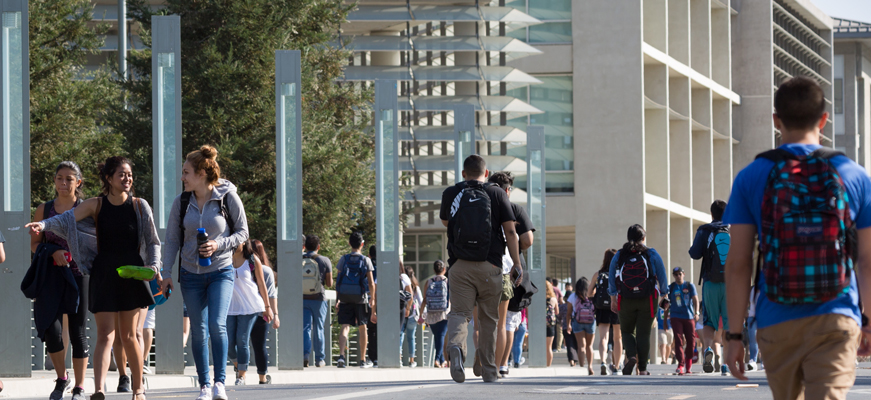 UC Merced students walking down Scholar Lane.